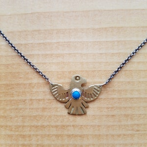 Brass, Turquoise, and Sterling Silver Thunderbird Pendant