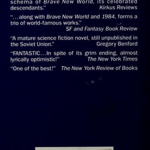 May include: A book cover with a blue background and the title "WE" in large white letters. The cover features several quotes about the book, including "As the first major anti-utopian fantasy...has its own peculiar wryness and grace, sharper than the pamphleteering of 1984 or the philosophical schema of Brave New World, its celebrated descendants." and "FANTASTIC... In spite of its grim ending, almost lyrically optimistic!" The cover also includes the price of the book, $5.99.