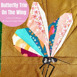May include: A patchwork butterfly design with the text "Butterfly Trio On The Wing" and "A Set of 6 Blocks By Kitsch Empire Patterns". The butterfly is made from patterned fabrics in pink, blue, and yellow, set against a brown background with white dots.
