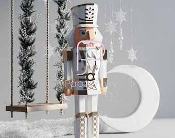 May include: White papercraft nutcracker figurine with a brown hat and gold accents. The nutcracker is standing on a white surface with a crescent moon and a swing set in the background.