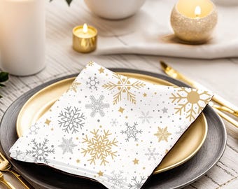 Snöflingeservett i guld och silver: Elegant julbordsdekoration