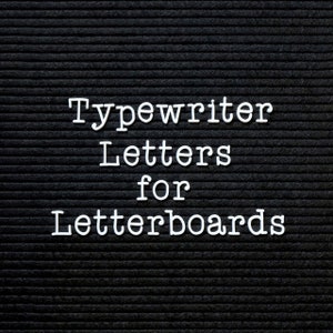 May include: White plastic letters spelling "Typewriter Letters for Letterboards" on a black felt letter board.