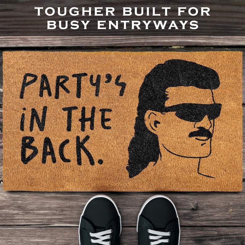May include: A brown doormat with the text "Party's in the back." and a black and white illustration of a person with a mullet and sunglasses.