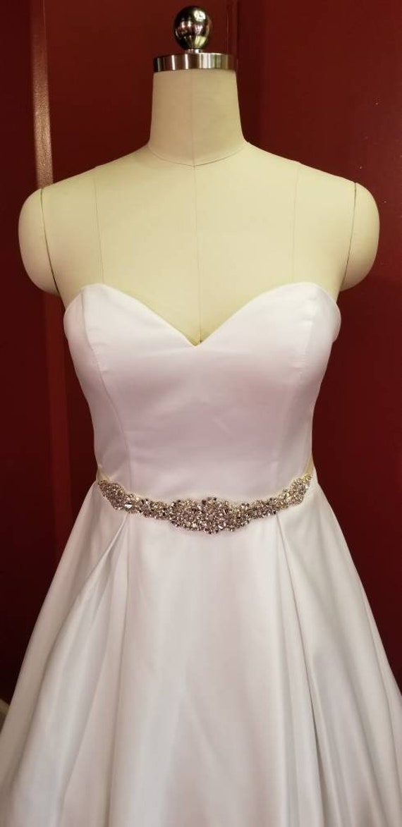 wedding gown with sweetheart neckline, ballgown, box pleated skirt, cathedral train and beaded sash. wedding gown with sweetheart neckline, ballgown, box pleated skirt, cathedral train and beaded sash.