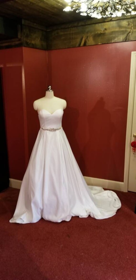 wedding gown with sweetheart neckline, ballgown, box pleated skirt, cathedral train and beaded sash. wedding gown with sweetheart neckline, ballgown, box pleated skirt, cathedral train and beaded sash.