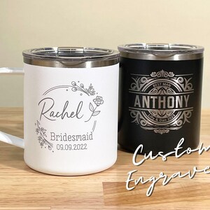 White & black custom engraved tumblers. Personalized Rachel Bridesmaid 09.09.2022 and Anthony Best Man Lilly & Dan 2023 tumblers, perfect for wedding party gifts. Stainless steel with clear lids.