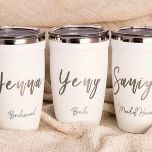 Personalized bridal party tumblers: Jenna Bridesmaid, Jenny Bride, and Saniya Maid of Honour custom stainless steel cups with metallic script font. Perfect for wedding gifts and bachelorette parties.