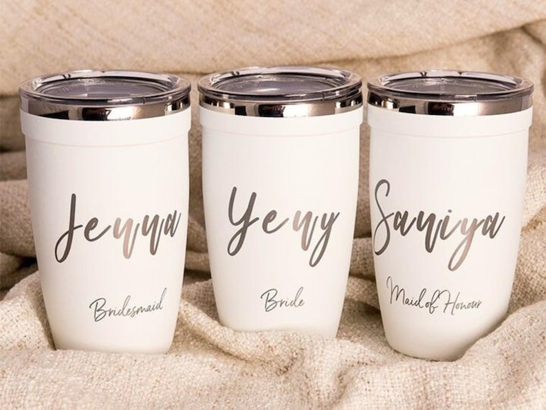 Personalized bridal party tumblers: Jenna Bridesmaid, Jenny Bride, and Saniya Maid of Honour custom stainless steel cups with metallic script font. Perfect for wedding gifts and bachelorette parties.