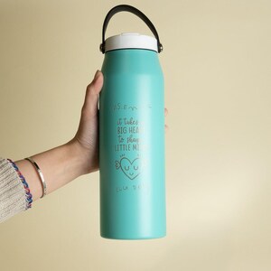 Personalized turquoise water bottle for teachers. Engraved with It takes a big heart to shape little minds and customizable name. Perfect teacher gift.