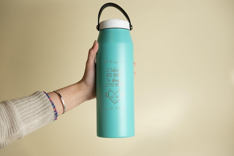 Personalized turquoise water bottle for teachers. Engraved with It takes a big heart to shape little minds and customizable name. Perfect teacher gift.