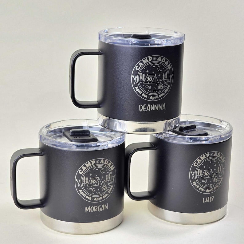 Personalized Camp Adam tumbler mugs, set of 3, black stainless steel with clear lids. Custom engraved with names, '30' milestone, and camping graphics. Perfect for campers, outdoor enthusiasts, and milestone celebrations.