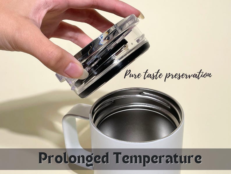White insulated travel mug with silver lid, featuring Pure taste preservation and Prolonged Temperature text. Perfect for hot or cold beverages, travel, and daily use.