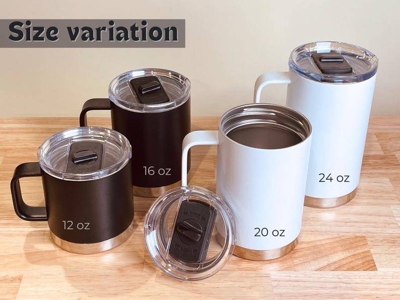 Assorted stainless steel tumblers with handles and lids in black and white, 12 oz, 16 oz, 20 oz, and 24 oz sizes. Perfect for hot or cold beverages, travel, and personalization.