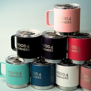 Stack of insulated tumblers with handles, custom FOOD4 FARMERS logo. Available in pink, black, navy, teal, red, white, and dusty rose. Perfect for coffee, tea, or drinks on the go.