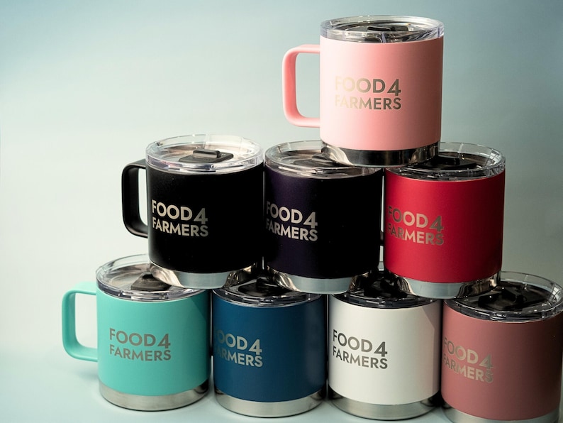 Stack of insulated tumblers with handles, custom FOOD4 FARMERS logo. Available in pink, black, navy, teal, red, white, and dusty rose. Perfect for coffee, tea, or drinks on the go.