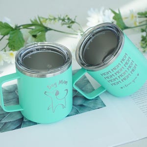 Mint green stainless steel tumblers for dog moms. Features Dog Mom and Mom Mom Mom text with a dog silhouette. Perfect gift for dog lovers, a cute way to enjoy drinks on the go.