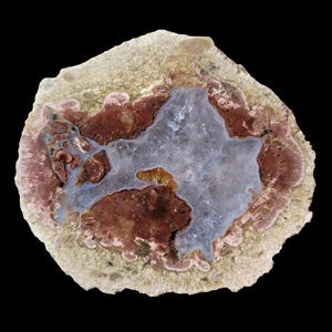 May include: A cross-section of a geode with a large, light blue agate center surrounded by brown, pink, and white bands.