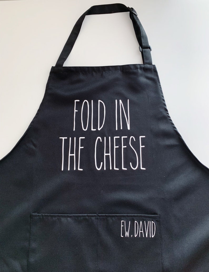 Top 27 Best Schitt's Creek Gifts from Etsy featured by top Seattle lifestyle blogger, Marcie in Mommyland: Fold In The Cheese Apron David and Moira Rose image 0