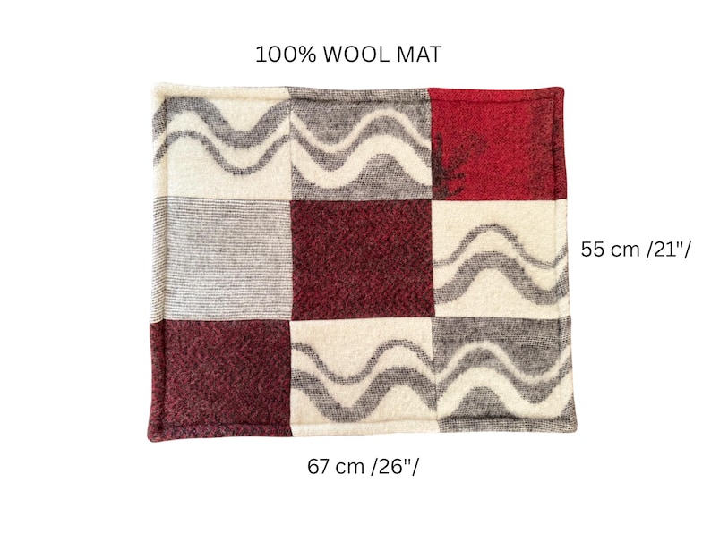 100% natural wool pet mat, geometric diagonal pattern in shades of light and dark grey, square shape on wood floor.