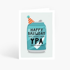 May include: A blue and white can with a party hat on top. The can says "Happy Brewday" and "YPA Brewed with Age".