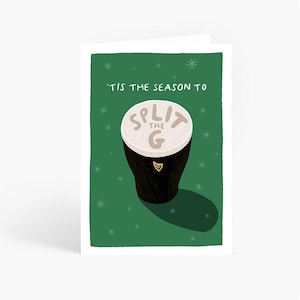 May include: Greeting card with a green background and white snowflakes. The card features a cartoon illustration of a pint of stout with the text "'TIS THE SEASON TO SPLIT THE G". The pint has a white foamy top.