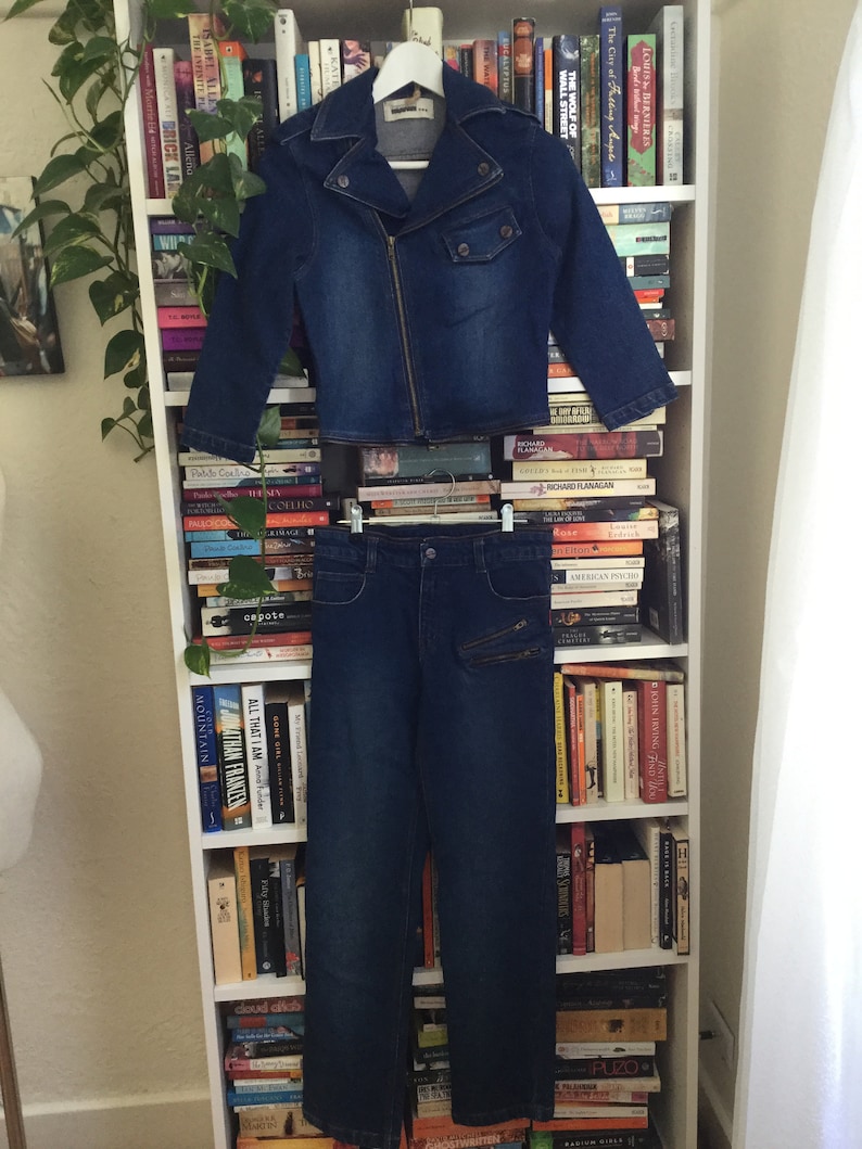 still has it\u2019s original tags never worn she\u2019s tiny! BEST jumpsuit EVER Zipper connected Size 4-6