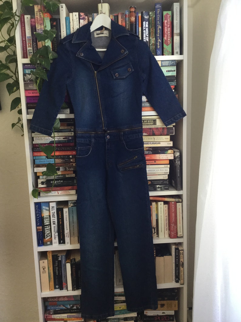 still has it\u2019s original tags never worn she\u2019s tiny! BEST jumpsuit EVER Zipper connected Size 4-6