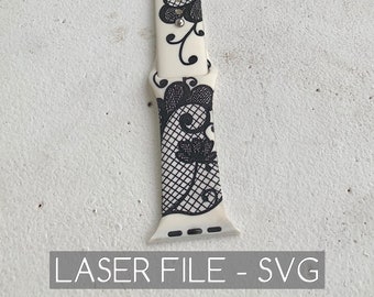 May include: White and black watch band with a lace pattern. The band is made for an Apple Watch and has the text "Riley Black" on a white tag.
