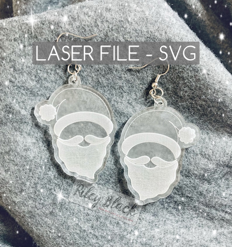 May include: A pair of clear acrylic earrings with a laser-cut design of Santa Claus's face. The earrings are hanging from silver hooks. The text "LASER FILE - SVG" is printed on a gray background.