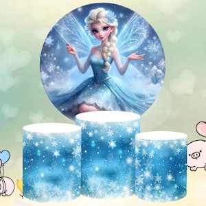 May include: Three round cake stands with a blue and white snowflake pattern. The top stand features a circular image of a fairy with blue wings and a blue dress. The fairy is holding a wand and has blonde hair.