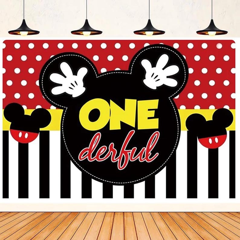 May include: A black and yellow Mickey Mouse head backdrop with red polka dots and black and white stripes. The backdrop says "ONE derful" in yellow and red letters.
