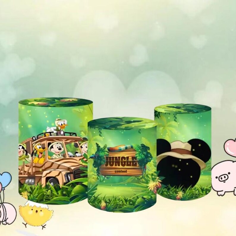 May include: Three cylindrical display stands with jungle-themed designs. One features Mickey Mouse and friends in a safari vehicle, another has a "Jungle Contest" sign, and the third has a Mickey Mouse silhouette.