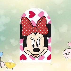 May include: A cartoon illustration of Minnie Mouse with a red polka dot bow and a smiling face. The background features a pattern of pink hearts on a white surface. The overall theme is a cheerful, animated character.
