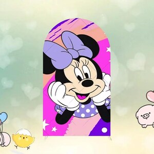 May include: A colorful illustration of Minnie Mouse, featuring a large purple bow, black ears, and a polka-dot dress. The background is a mix of pink, purple, and white, with a light green backdrop.