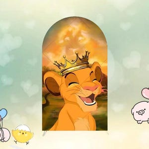 May include: A decorative arch featuring a smiling cartoon lion wearing a gold crown. The lion is orange with a pink nose and tongue. The background shows a sunset scene with a lion's face. The arch is supported by two small white legs.