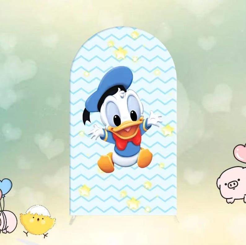 May include: A blue and white backdrop with a cartoon duckling wearing a blue sailor hat. The backdrop has a chevron pattern with white stars.