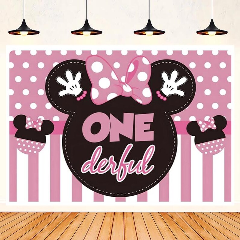 May include: Pink and black Minnie Mouse themed backdrop with white polka dots and pink and white stripes. The backdrop features a large Minnie Mouse head with a pink bow and the text "ONE derful".
