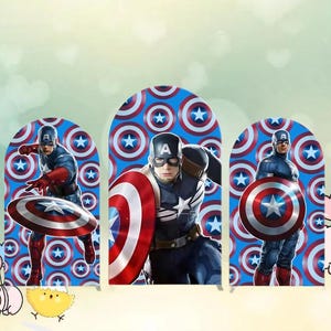 May include: Three Captain America cutouts. Each cutout features Captain America in a blue and red costume, holding his shield. The background is a blue pattern with white stars and red circles. The cutouts are in an arch shape.