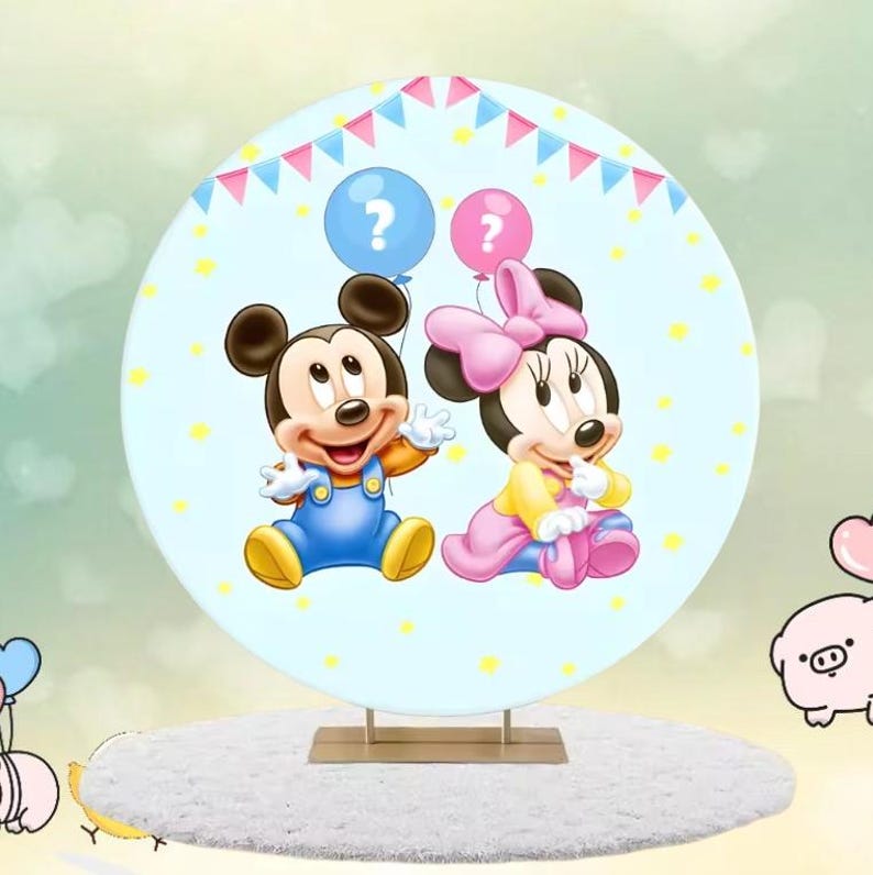 May include: A circular, light blue decorative item with Mickey and Minnie Mouse illustrations. Mickey is in blue dungarees, Minnie in a pink bow and dress. They hold question mark balloons. The background has yellow stars and a banner.