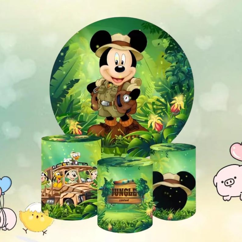 May include: A vibrant jungle-themed party decoration set featuring Mickey Mouse in safari attire. The set includes a large circular backdrop and cylindrical containers with jungle and character graphics. The backdrop showcases Mickey in a jungle setting.