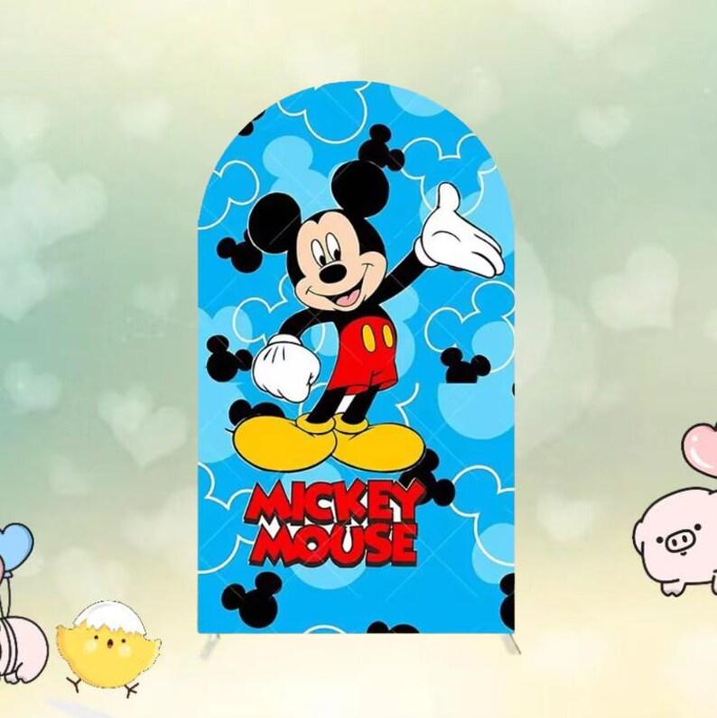 May include: A blue backdrop featuring Mickey Mouse. The cartoon character is in the center, with a red shirt, yellow shoes, and white gloves. The words "Mickey Mouse" are in red. The background is light blue with white Mickey Mouse silhouettes.