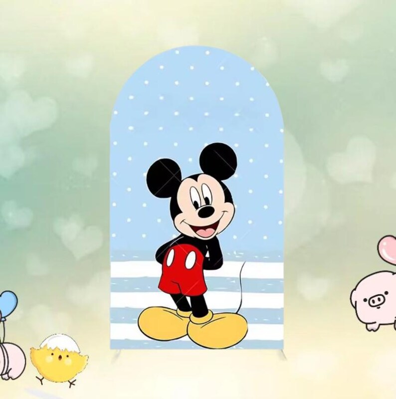 May include: A large, arched backdrop featuring a cartoon Mickey Mouse character. Mickey is depicted in his classic outfit: red shorts, yellow shoes, and black gloves. The background is light blue with white polka dots and horizontal stripes.