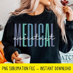 May include: A black sweatshirt with the text "MEDICAL assistant" in a colourful gradient design. The text is in a stylised font with each letter in a different colour.