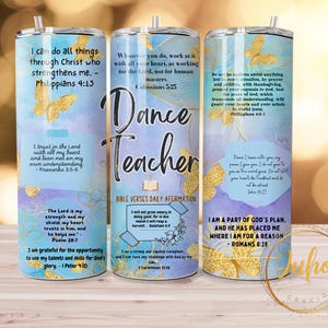 May include: Three stainless steel tumblers with inspirational quotes and a watercolor background. The tumblers feature quotes about faith, trust, and strength. The middle tumbler has the words "Dance Teacher" in gold lettering.