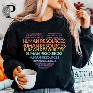 May include: Black sweatshirt with the text "HUMAN RESOURCES" repeated in rainbow colors.