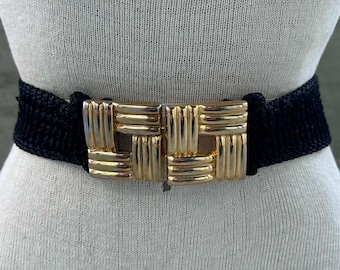 90s black elastic belt, chunky gold tone square textured buckle, maximalist fashion statement, sophisticated glam, NYC fashion week