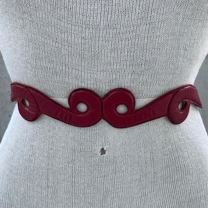 80s dark red belt, vintage thin leather belt, wavy design, minimalist fashion, unique eclectic style, sophisticated lady, fairycore wear