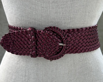 90s burgundy braided high waist belt, metallic glossy waistband, glam rock fashion, gothic aristocrat aesthetic, maximalist festival wear