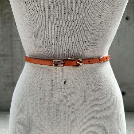 80s skinny orange belt, vintage faux patent leather skinny belt, gold tone buckle, elegant business attire, corporate accessories, wet look
