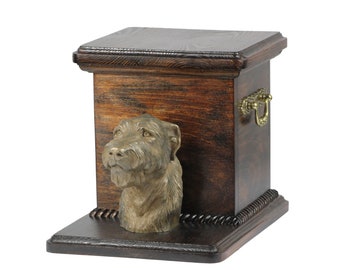 May include: A wooden pet urn with a bronze Irish Wolfhound head sculpture on the front. The urn has a dark wood finish and a brass handle.